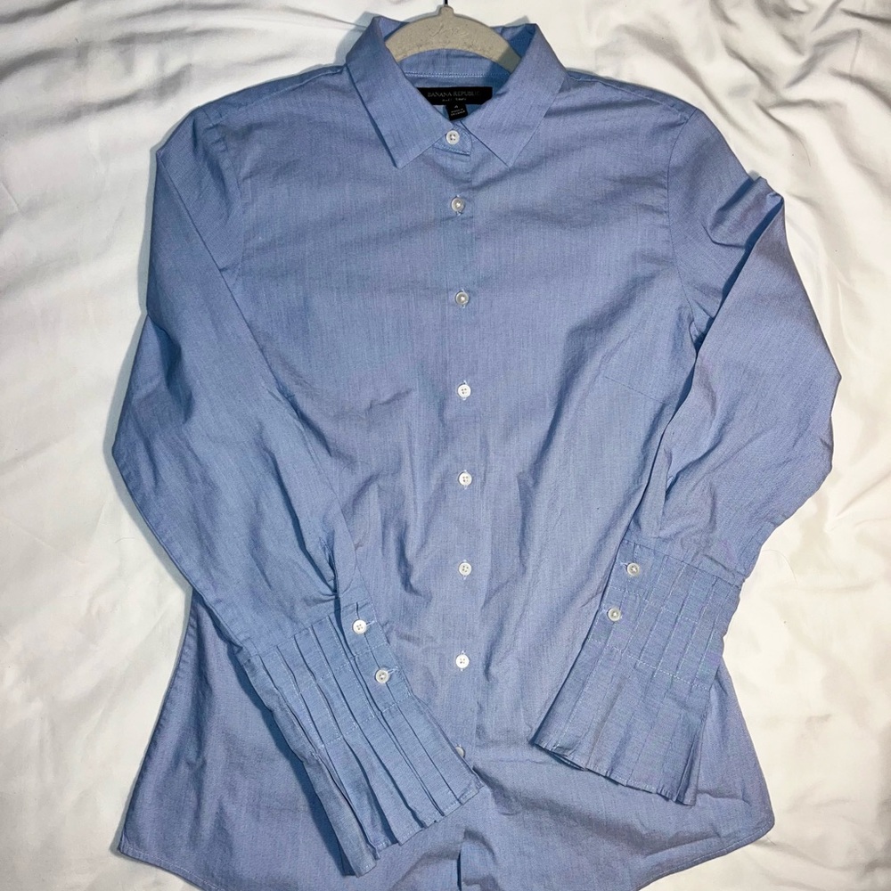 Banana Republic Blue Dress Shirt, has fanned out at the bottom of that sleeve